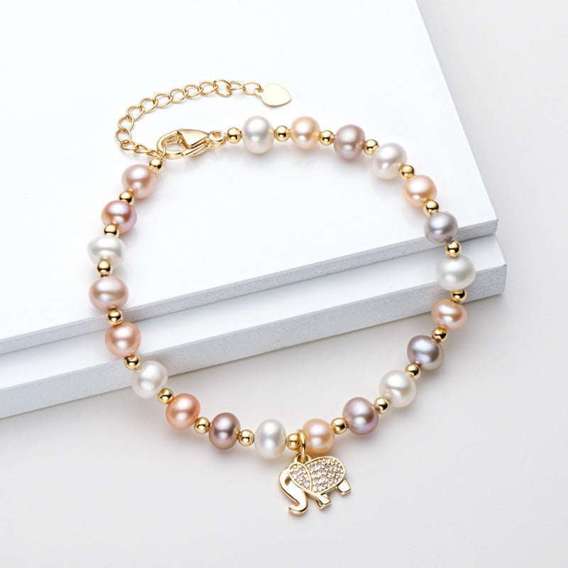 Elephant pearl bracelet with natural pearls, a perfect gift in gold packaging.