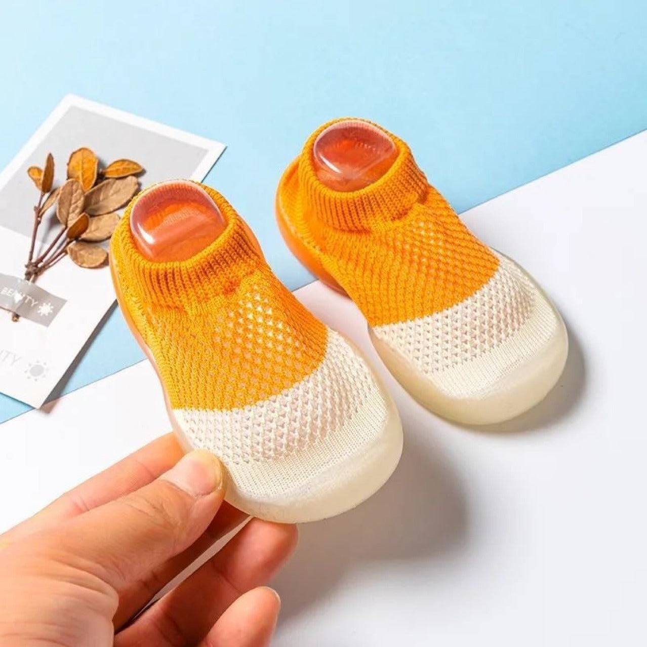 Summer children's soft sole anti-slip mesh shoes with floor holes.